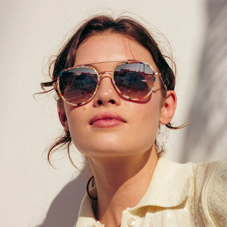 Woman wearing Krewe sunglasses